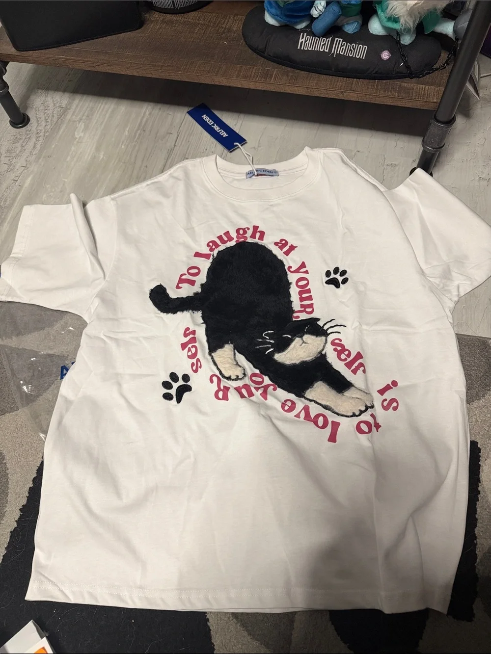 Aelfric Eden White Tee with Black Cat Graphic and Pink Text
